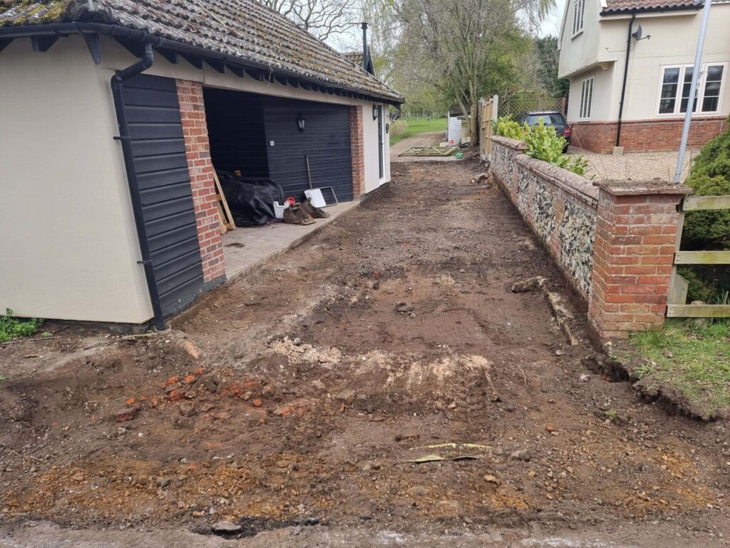 This is a tarmac driveway that is in the process of being dug out and installed by NS Driveways Cranleigh
